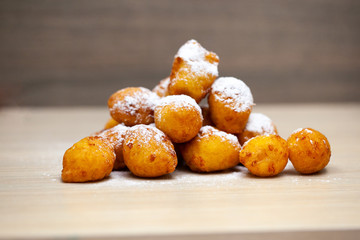A piece of sweet cake with mint on the table, close-up