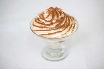 A piece of sweet cake with mint on the table, close-up