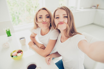 Self-portrait of two nice cute lovely sweet attractive charming cheerful cheery people blonde mom...