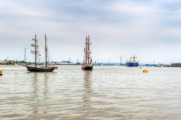 Tall Ship passing a tanker in the Tall Ships Regatta in London