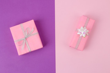 Gift boxes. Gifts on a bright lilac and pink background. Holidays. Valentine's Day. women's Day. mother's day. view from above.
