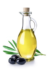 Branch with olives and bottle of virgin olive oil