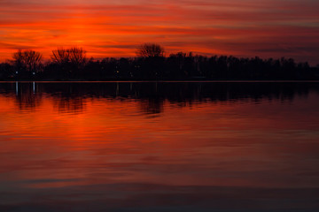 Obraz premium The ever changing pearly sky is beautifully reflected in the water of the Lake Zoetermeerse plas, Netherlands