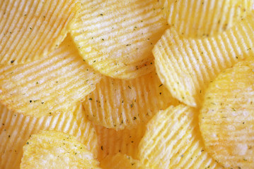 Golden wavy chips close-up