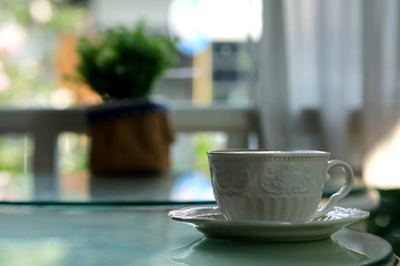 Special recipe hot latte in white coffee cup and space for write wording served in a restaurant, popular drink for meeting place, value added, coffee shop is very big and fast growing business