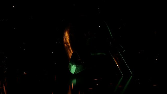 animation of ancient greek Sparta type helmet in red and green light and flying sparks