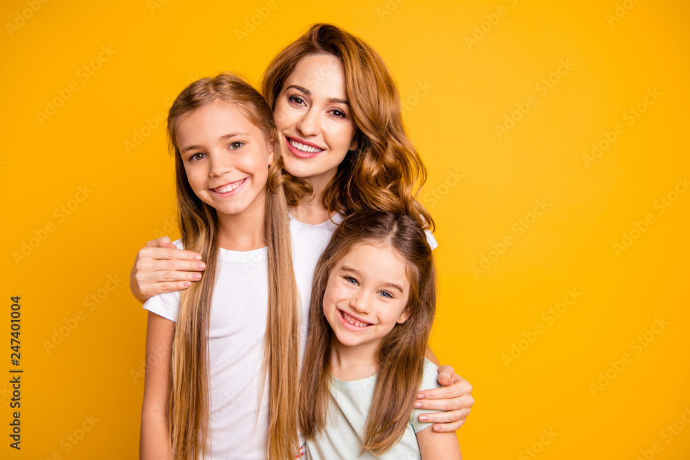 Sticker Portrait of three nice cute lovely winsome attractive cheerful cheery blonde positive people cuddling bonding relatives isolated over bright vivid shine yellow background