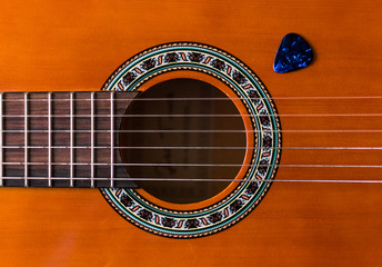 Obraz premium Classical wooden guitar strings close up