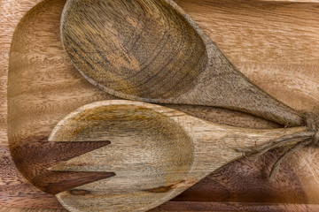 Fototapeta na wymiar Wooden spoon and fork on table Wooden spoons on a wooden board.