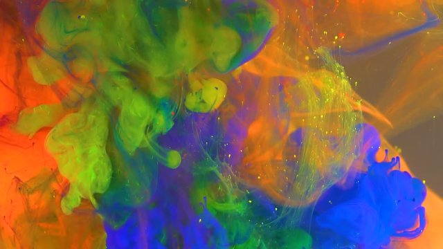 Colorful paint in water. Slow Motion