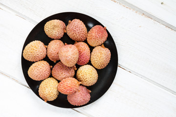 Bowl with lychee fruits.