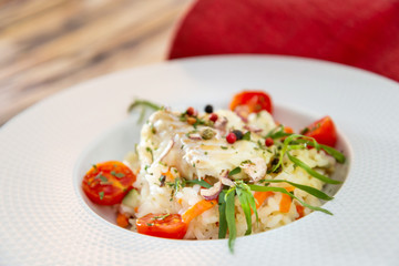 Andalusian fish, saffron rice with vegetables