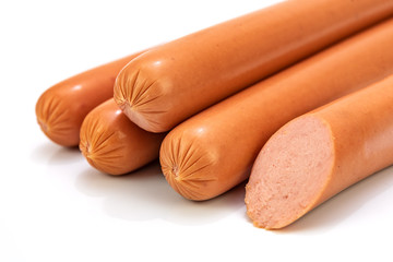 Group of boiled frankfurter sausages isolated on a white background in close-up