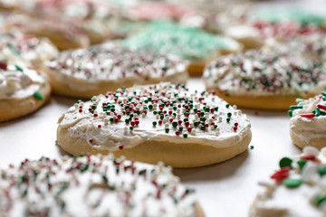 Christmas sugar cookies frosted with sprinkles.  Close up view.