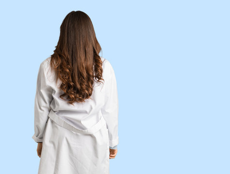 Full Body Young Doctor Woman From Behind, Looking Back