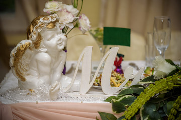 Beautiful restaurant interior table decoration for wedding or event. Flower Wedding Table Decoration