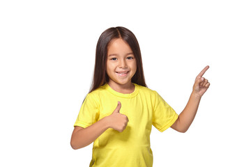 Girl in yellow t-shirt shows her hands with thumbs