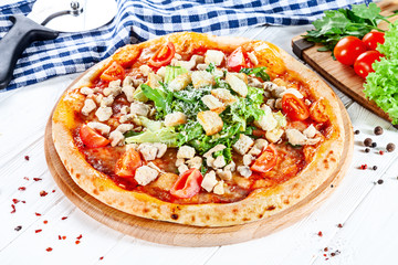 Close up view on pizza on white wooden background with ingridients. Italian cuisine. Ready to Eat. Restaurant, food menu, recipe, cafe concept. Lifestyle with copy space