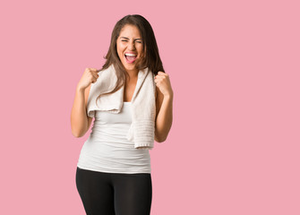 Full body young fitness curvy woman screaming very angry and aggressive