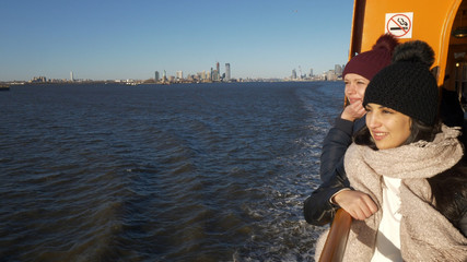 Two young women on a ferry in New York