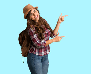 Full body young traveler curvy woman pointing to the side with finger