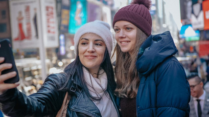 Two friends at Times Square New York for sightseeing