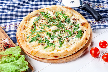 Close up view on pizza on white wooden background with ingridients. Italian cuisine. Ready to Eat. Restaurant, food menu, recipe, cafe concept. Lifestyle with copy space
