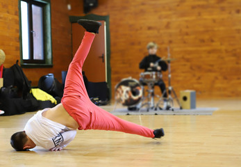 breakdance to live music, a boy playing drums