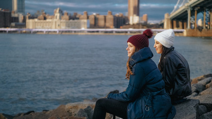 Two friends in New York enjoy the amazing view over the skyline of Manhattan