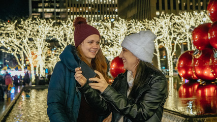 Two girls visit New York at wonderful Christmas time