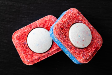 dishwasher tabs on black background