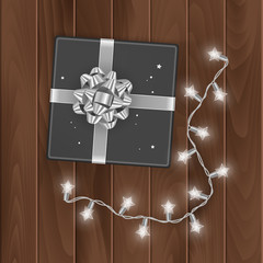 Black gift box, top view, gift box isolated on transparent background with silver bow