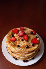 Thin pancakes with crispy crust. Maslenitsa. Pancakes for breakfast and carnival.