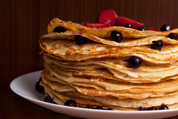 Thin pancakes with crispy crust. Maslenitsa. Pancakes for breakfast and carnival.