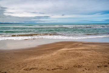 waves of the Atlantic Ocean rolling on the sand
