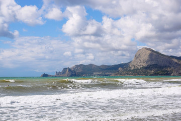 Fototapeta na wymiar Landscapes of the Crimea. View of Mount Sokol and Cape Kapchik from Sudak Bay.