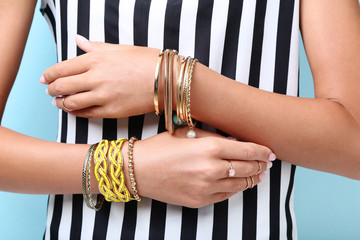 Female hands with bracelets and rings