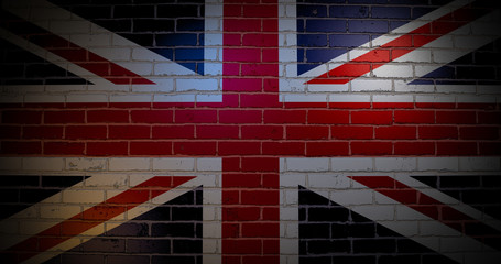 Fototapeta premium United Kingdom flag on the brick wall.