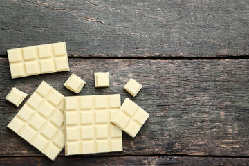 White chocolate bars on grey wooden table