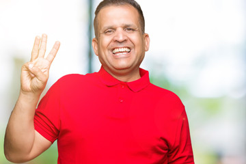 Middle age arab man over isolated background showing and pointing up with fingers number three while smiling confident and happy.