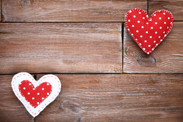Fabric hearts on brown wooden table