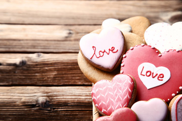 Valentine day heart shaped cookies on brown wooden table