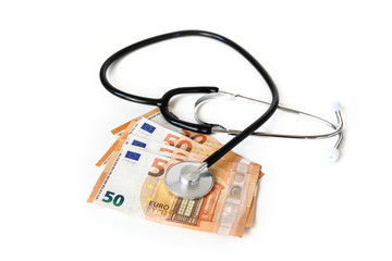 stethoscope on euro money banknotes, healthcare costs or medical corruption concept isolated on a...
