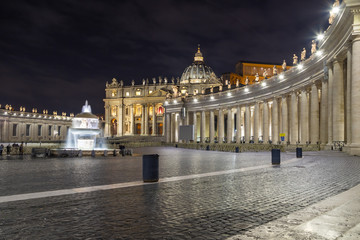 Fototapeta na wymiar St. Peter's Cathedral on Saint Peter's square (Piazza San Pietro) in Vatican at night, center of Rome, Italy