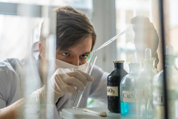 science worker conduct experiments with chemical liquid b