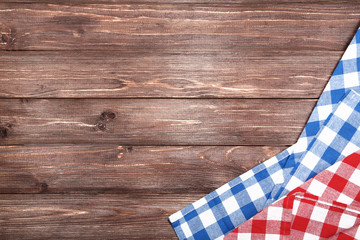 Red and blue napkins on brown wooden table