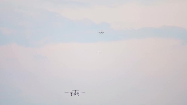 Airplanes lined up for landing