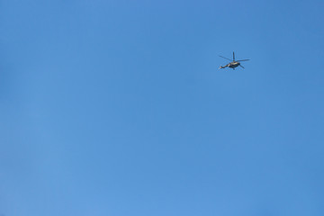 blue sky on which helicopter flies