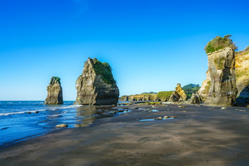 on the beach, 3 sisters and elephant rock, new zealand 12