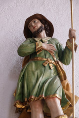 Obraz premium Statue of Saint in the Saint Lawrence church in Kleinostheim, Germany